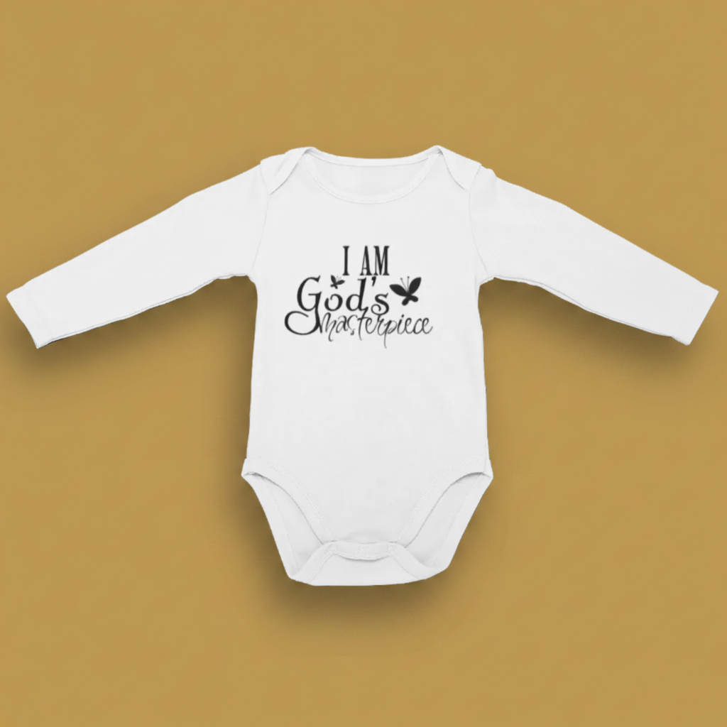 White long sleeve baby grow printed with I Am God's Masterpiece and a butterfly, laid flat.