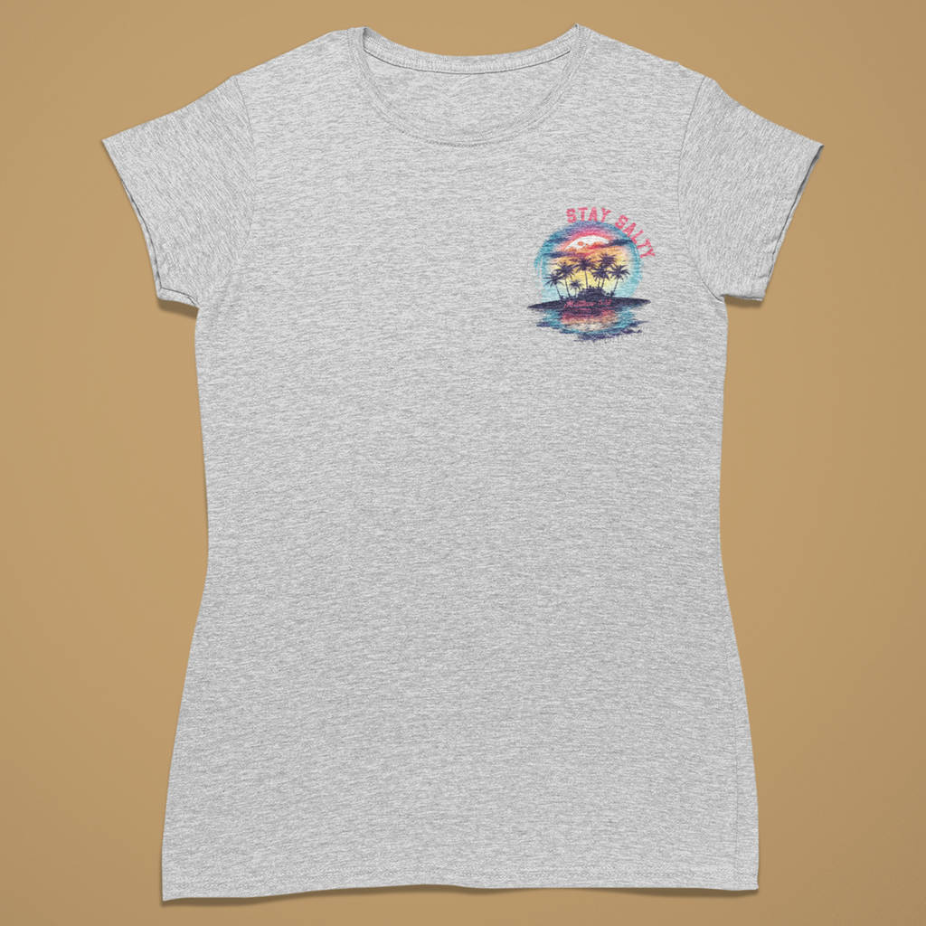 A light heather gray short-sleeve t-shirt with a small multicolor graphic on the left chest depicting a sunset over water with palm trees and the text 'STAY CALM', displayed flat against a solid tan background.